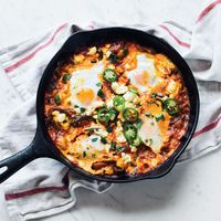 Learn to make these simple Mexican-style baked eggs with cheese at Food & Wine.