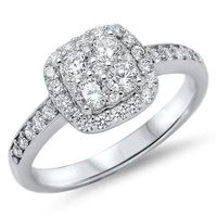 Elegance and romance meet together in this intricately designed studded engagement ring. The sterling silver band features four cubic zirconia stones surrounded by a square halo and accented by smaller studs on both sides of the shaft. The accent stones are set in channel and adds brilliance to the highly polished band.