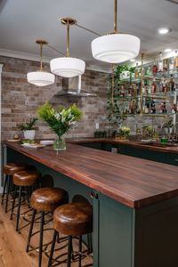 This home bar is situated in a 600 square feet ADU in the back of an Historic Downtown Los Gatos home. The design of this space fits perfectly into the footprint of the property with a connecting patio, firepit and lounge space that brings an indoor-outdoor flow perfect for entertaining. #homebar #entertaining #bar #happyhourathome #homebardesignideas #homebarideas #guesthouse #casita #AccessoryDwellingUnit #palmerindustries #brassshelving #rejuvenationlighting #homebarinspiration #homebarinspo