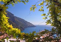 A beautiful vista of Positano, Italy framed by wisteria vines. See it in person with In Splendid Company small group tours! www.insplendidcompany.com
