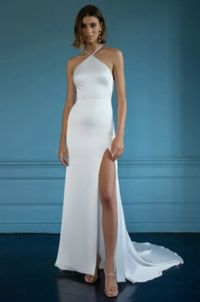 Sleek and modern fitted satin wedding dress with high neckline, swoop low back and train. Available to try on in store in size 12. #MissRubyBride Milwaukee, Wi