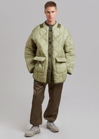 Color: Moss Green Quilted technical fabric Boxy oversized silhouette Contrast piping and trim Back neck patch detailing Front flap pockets Split cuffs Curved slit hem Front button closure Unlined 100% Polyester Dry Clean By The Frankie Shop. Imported Product Measurements: XS/S- 24" Shoulder, 52" Chest, 32" Length M/L- 25" Shoulder, 54" Chest, 32.5" Length Model is 181cm/5'11" wearing size XS/S *Due to the unique construction of this garment, measurements may vary from piece to piece