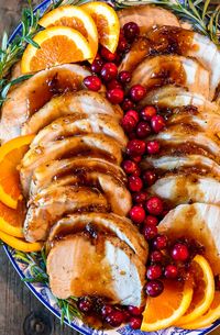 This Pork Loin Roast recipe is the perfect holiday main dish! This Orange Cranberry Pork Loin Roast is juicy, delicious, and super festive. Add this roasted pork recipe to your Thanksgiving and Christmas tables!