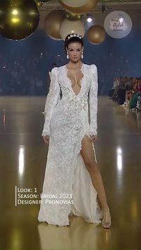 White Lace Wedding Dress with Deep V-Neck Cut, Long Sleeves and a Slit from the 2023 Bridal Collection by Pronovias. Atelier 2023 Collection.