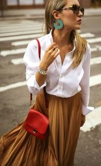 A classically chic look, let your skirt stand out with a white collared shirt and simple accessories.