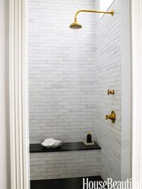 Grove Brickworks tile and Henry showerhead, all by Waterworks, in the master bath.