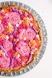This vegan Chocolate Chip Cookie Cake is soft, chewy & crispy on the edges. Decorate with frosting & sprinkles for the perfect celebration treat! #glutenfree #nutfree