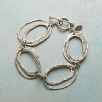 LINKOLOGY BRACELET - The classic chain link bracelet redefined with ovals within ovals of hammered sterling silver and 14kt gold filled, all fastened by a handcrafted sterling toggle.