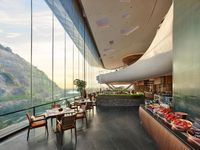 Year opened: 2021. The DNA: Located above Tang Mountain, the Banyan Tree is a sustainably designed hotel by Cheng Chung that aims to restore the long abandoned quarry it calls home. The lobby's minimalist design seamlessly merges with the mountain range via floor-to-ceiling windows, while the curving lines of the architecture make the space in harmony with the natural landscape.
