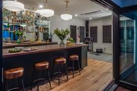 This home bar is situated in a 600 square feet ADU in the back of an Historic Downtown Los Gatos home. The design of this space fits perfectly into the footprint of the property with a connecting patio, firepit and lounge space that brings an indoor-outdoor flow perfect for entertaining. #homebar #entertaining #bar #happyhourathome #homebardesignideas #homebarideas #guesthouse #casita #AccessoryDwellingUnit #palmerindustries #glassshelving #brassshelving #homebarinspiration #homebarinspo