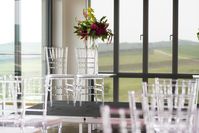Transparency is among the biggest of 2018 wedding trends, and this industrial inspired wedding shows how it can produce a striking contrast with the colourful floral design.