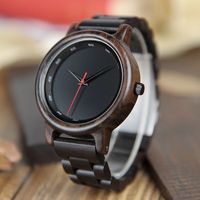 This sophisticated men’s watch features dark wood tones against a black dial face, giving it an air of mystery. Dark tones and minimalist design gives this watch effortless style while delivering reliable function. It is lightweight and comfortable to wear, making it a great everyday accessory. Perfect to give as gifts for special occasions, you can add a custom engraving on the back side of the watch up to 4 lines of 20 characters each at no added cost.