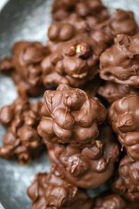 These delicious, gourmet Chocolate Marshmallow Peanut Clusters are the most decadent chocolate candies ever! Chocolate covered fluffy marshmallows and roasted peanut clusters are totally life changing yummy! There isn't an easier no-bake chocolate treat than these easy chocolate clusters