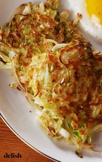We seriously CANNOT believe these crispy hash browns aren't potatoes. Get the recipe at Delish.com. #recipe #easy #easyrecipes #delish #cabbage #hash #browns #breakfast #brunch #lowcarb #low #carb #diet #dieting #weightloss