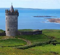 Doolin, Dunagore Castle and the Aran Islands in the background.