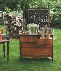 Popcorn bar | http://abetterhappierstsebastian.com/journal/2014/8/3/garden-engagement-party