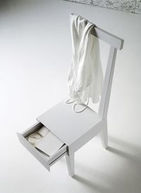 White wooden chair with a secret drawer. Perfect for small spaces