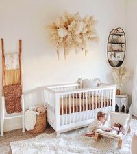 Gender neutral nurseries are trending up 527% on Pinterest for 2020; are you a “yay” or “nay”?? Check out our favorites today on the blog, and give us allllll the pampas grass 😍 Nursery via @@nicoleeachus #nursery #genderneutral #organicbaby #babynursery #babyroom