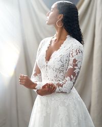 Kingsley has it all! Boho, vintage, AND regal vibes! The unique floral lace is irrisistable! Click through to see if it's the dress for you! #alineweddinggown #regalbridaldress #bohoweddingdress #vintagebridalgown #kingsleysotteroandmidgley #maggiesottero