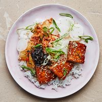Whenever you’re cooking tofu, here’s one of our no-fail techniques: Draining the tofu, then squeezing out as much water as possible (without smashing it), is the key to the crispiest cubes.