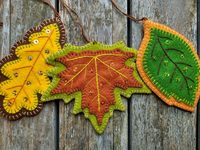 "This set of fall leaf ornaments comes with three wool felt leaves embroidered with shimmery thread and embellished with sequins and beads. These ornaments are made from merino wool felt and wool blend felt, made by me using my own original design. Each ornament has an extra long brown pearl cotton hanger so that you can adjust the length as needed. Approximate sizes: Maple Leaf: 5 1/8\" x 4 1/2\" Oak Leaf: 3\" x 5 1/4\" Beech Leaf: 2 7/8\" x 5\" Made in a smoke free environment If you want to t