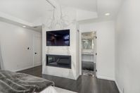 Master Bathroom Retreat. #whitecabinetry #brasshardware #masterbathroom #masterbath #shower #marble #fireplace #bedroomfireplace #fireplaceideas