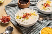 Warm, yummy, and so easy to make... who doesn't love that grouping of words together?! Irish Potato Soup does it all and then some. You dip your spoon into a creamy, cheesy, savory mix, loaded with tender potatoes, nourishing veggies, salty bacon, and lots of flavor! Top it with more melty cheese, crispy bacon, and herbaceous chives to really get the full effect. Dinner time never felt so fulfilling! Not until Irish Potato Soup made its appearance at least!