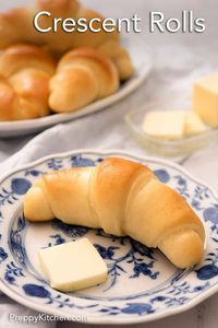 Baked to golden perfection, these homemade Crescent Rolls are soft, fluffy, and sweet. These crescent rolls are made with only eight simple ingredients and are so easy to put together! They are better than store bought and are the perfect addition to any meal or just a tasty treat by themselves! #crescentrolls #homemaderolls #sidedish #breadrecipes