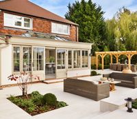 Beautiful orangery with spray-applied internal and external joinery in three coats of water-based microporous paint in Portland Stone, a cool grey shade from Westbury palette collection.