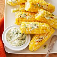 A dash of crushed red pepper adds the perfect amount of spice to this flavorful cilantro-lime corn on the cob. #gameday #football #recipe #eatingwell #healthy