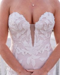 Strapless Lace Mermaid Wedding Dress Hattie by Rebecca Ingram. Click to find this gown! . . . . #straplessweddingdress #laceweddingdress #mermaidweddingdress #bohoweddingdress #tulleweddingdress #beachweddingdress