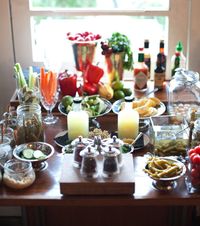 Just like a buffet for food, create a self-service bar with mixers, condiments and garnishes for cocktails so your guests can pick and experiment with their drinks. Image courtesy, Melissa Hom for Saxon and Parole