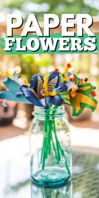 These bright and beautiful tropical paper flowers are made from scrapbook paper and card stock. I was inspired by the gorgeous tropical flowers in warm weather climates. #paperflowers #paperflowertutorial #papercrafts #paperlilies #tutorial #craftsbyamanda