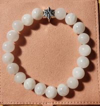 Jade is known for strength, luck, and good health. It is also revered for its healing properties, balancing the body's processes.