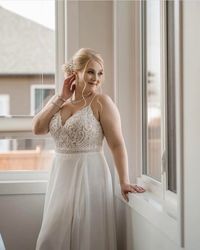 Beaded Chiffon Sheath V-neck Wedding Dress Lorraine by Rebecca Ingram. Click to find this gown! . . . . #beadedweddingdress #chiffonweddingdress #sheathweddingdress #vneckweddingdress #laceweddingdress