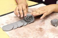 We made these roses with clay, but it could be done with Fimo or Sculpey, or any other kind of air dry clay in time for Mother's Day if...
