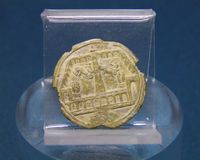 Bronze gaming token with circus scene, the other side bears a Roman numeral, 2nd-3rd century AD, Musée gallo-romain de Fourvière, Lyon