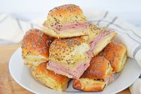 Ham and Cheese Sliders are easy, cheesy and delicious! One of the best recipe for parties of all types, from baby showers and birthday parties to holiday parties and casual family get-togethers.