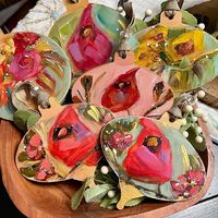 Marie Wheeler Art shared a post on Instagram: "I’ll have a few of the smaller 5” cardinals Saturday at The Barn in Forsyth. Then I’m done for the year. This girls has tuckered out…. #cardinals #redcardinal #ornaments #ornament #handmadeornaments #christmasornaments #artwork #artistsoninstagram #georgiaartist #floralart". Follow their account to see 1137 posts.