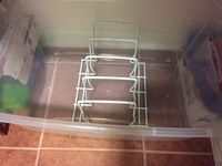 If you don't have a lot of storage space in your kitchen and your bakeware is cluttered you'll love this simple and easy kitchen storage solution. Cheap dollar store kitchen organization hack if you don't have a pantry or lots of kitchen cabinets or drawers.