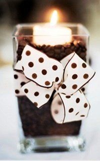 Place vanilla scented tea lights in a bowl of coffee beans. The warmth of the candles will heat up the coffee beans and make your house smell like french vanilla coffee.... I've seen this before where the candle melted into the beans... I think doing this with a pastlic-cup tealight is the way to go!
