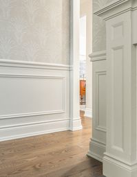 This charming bungalow had a great layout and good bones, but needed some updating and style. We completely gutted the kitchen and bathrooms and added personality with beautiful embossed wallpaper in the dining room and applied moulding in the living room. Custom panel draperies and beautiful marble looking wall tile in the master bathroom add warmth and texture. My absolute favourite feature is the wall panelling and marble floor and wall tile in the guest bathroom!