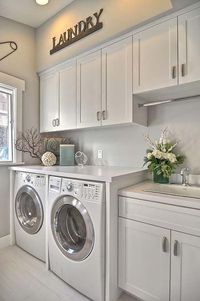 I like this design. Washer/dryer side by side, plus the sink. I would have a different color for the wall & cabinet, but otherwise I really like this