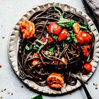 This recipe for Squid Ink Pasta with Shrimp & Cherry Tomatoes only looks fancy. It's easy to make in under 30 minutes and the flavor is delicious!