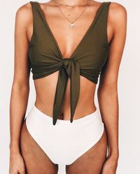 forest green top with high waisted white bottoms