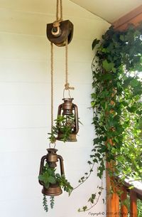 Lantern and pulley succulent planters by A Crafty Mix, featured on Funky Junk Interiors