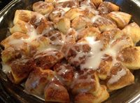 Ingredients: 1 roll of small canned biscuits 1/4 cup sugar 1 teaspoon cinnamon 1/2 stick butter (1/4 cup) Icing: powdered sugar (maybe a 1/2 cup-ish?) couple teaspoons milk (not sure how much, just add drops and mix until you get the consistency