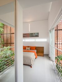A view of the bedroom on the second floor. Image courtesy, Lijo Reny Architects