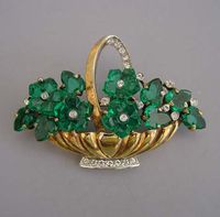 TRIFARI green glass flowers in a basket 2-1/3" brooch circa 1944.