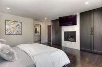 Master Bedroom with Fireplace. Portola Valley, CA home with custom cabinetry throughout. #interiordesign #fireplace #bedroom #masterbedroom #bedroomfireplace